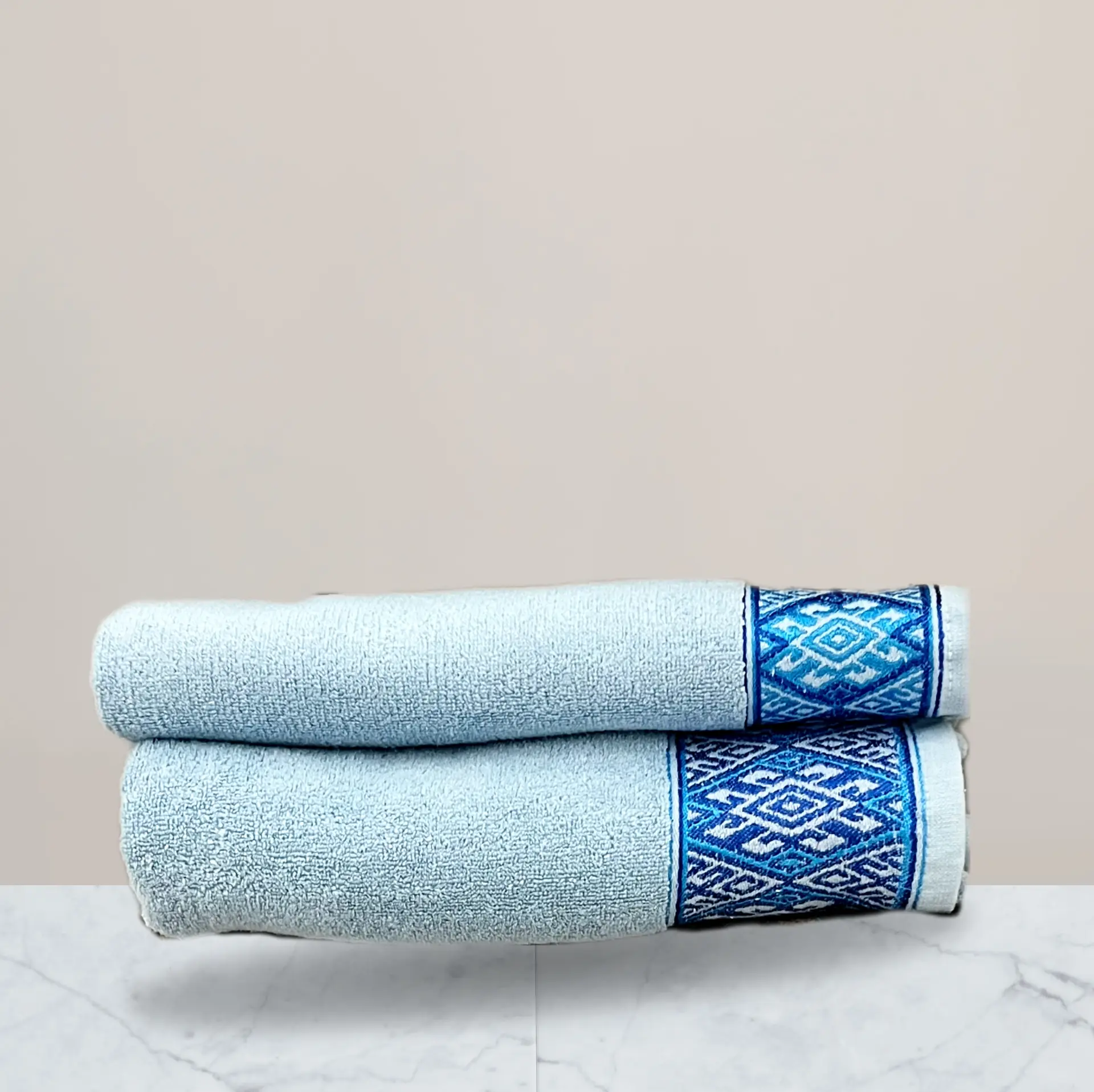 a stack of towels on a marble surface 600 gsm towel